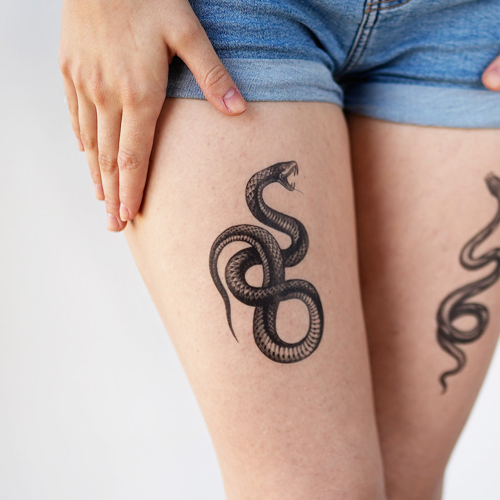 snake thigh tattoo