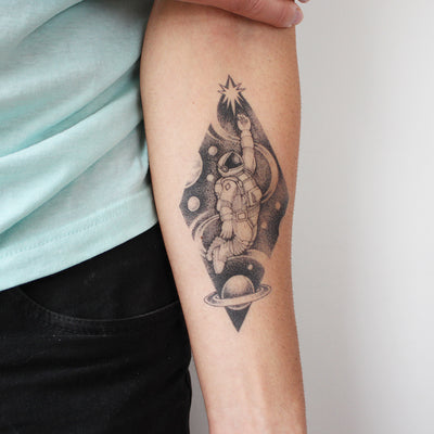spaceman tattoo