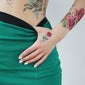 small red rose tattoo hand