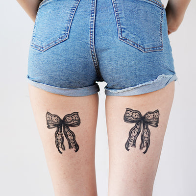 lace bow tie tattoo