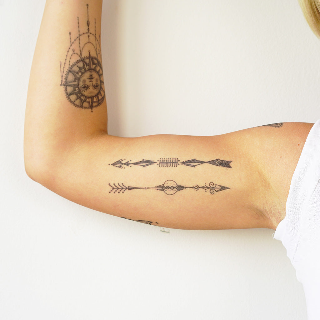 arrows biceps tattoo