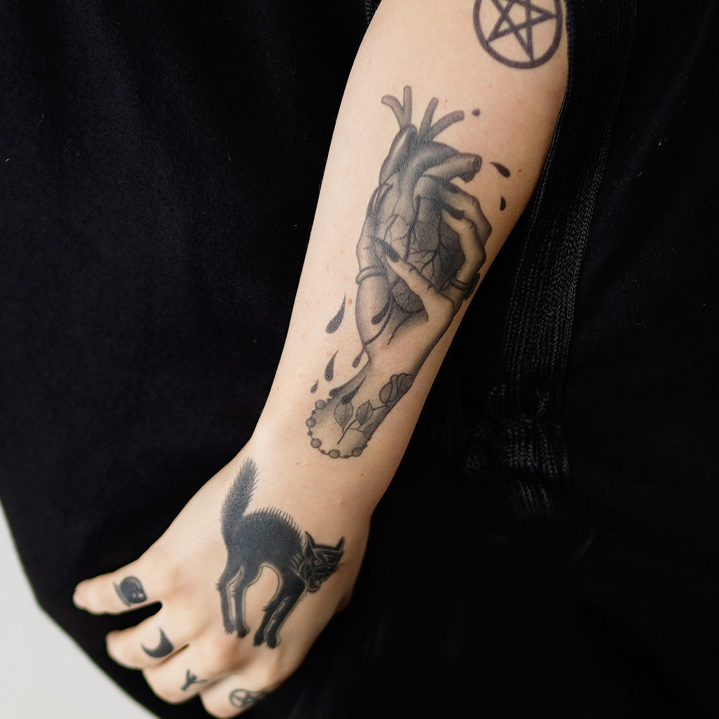 crushed heart tattoo design