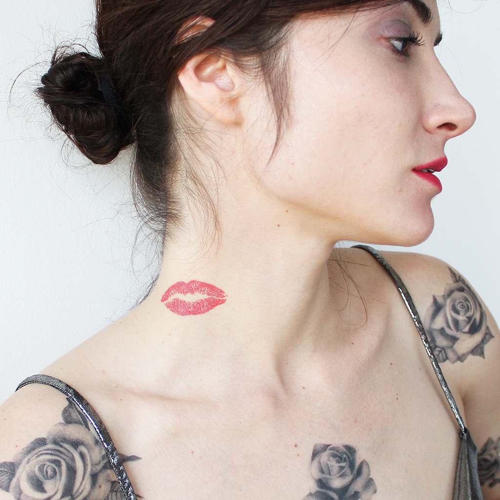 lips neck tattoo