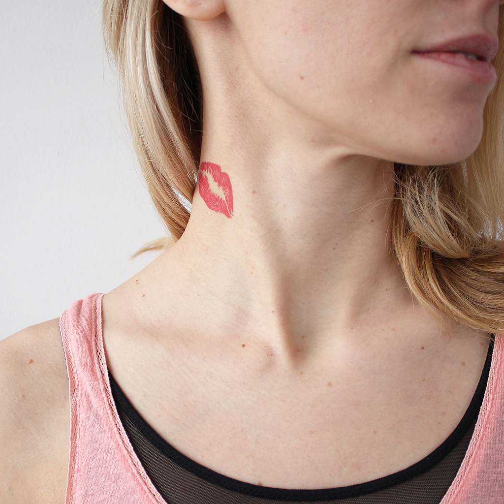 lips on neck tattoo