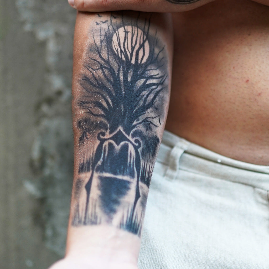 tree silhouette sleeve tattoo