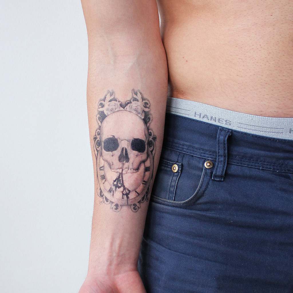 skull forearm tattoo