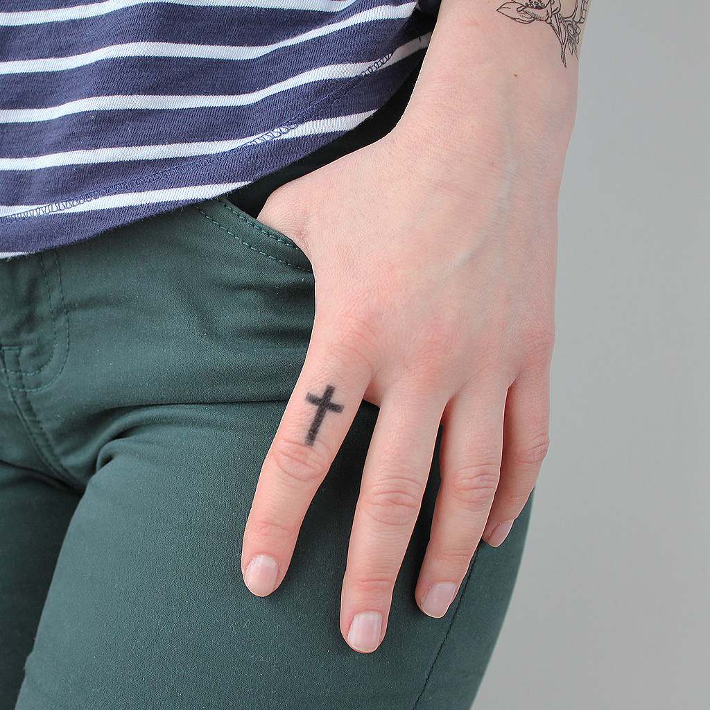 cross finger temp tattoo