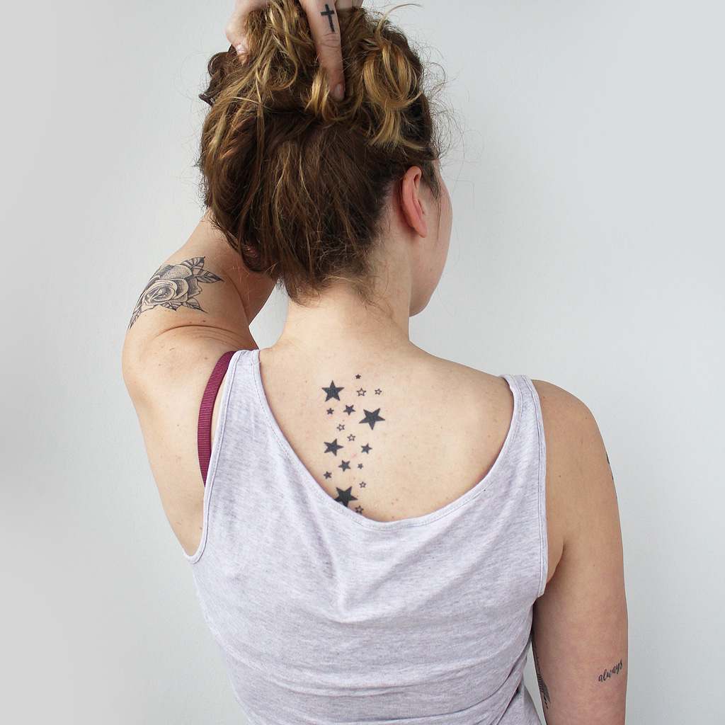 Lower Back Tattoos with Stars That Shine