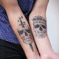 Skull with Dagger Tattoo