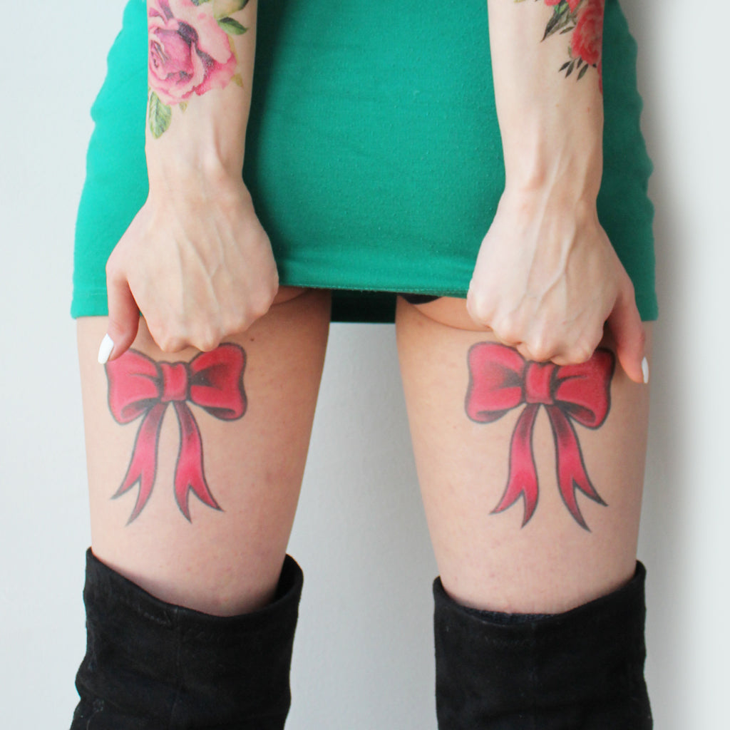 Outline Bow Tattoo On Back Leg