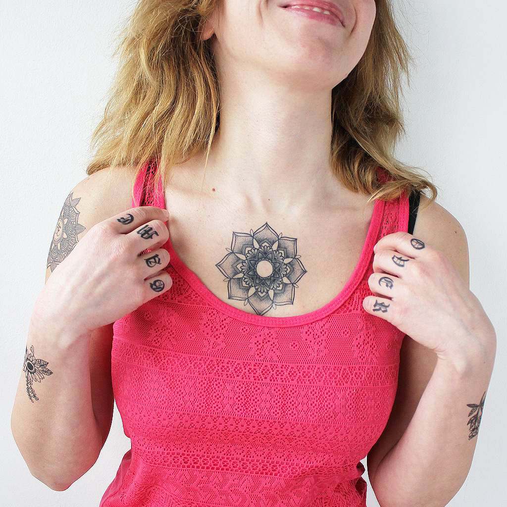 Flower chest tattoo for women