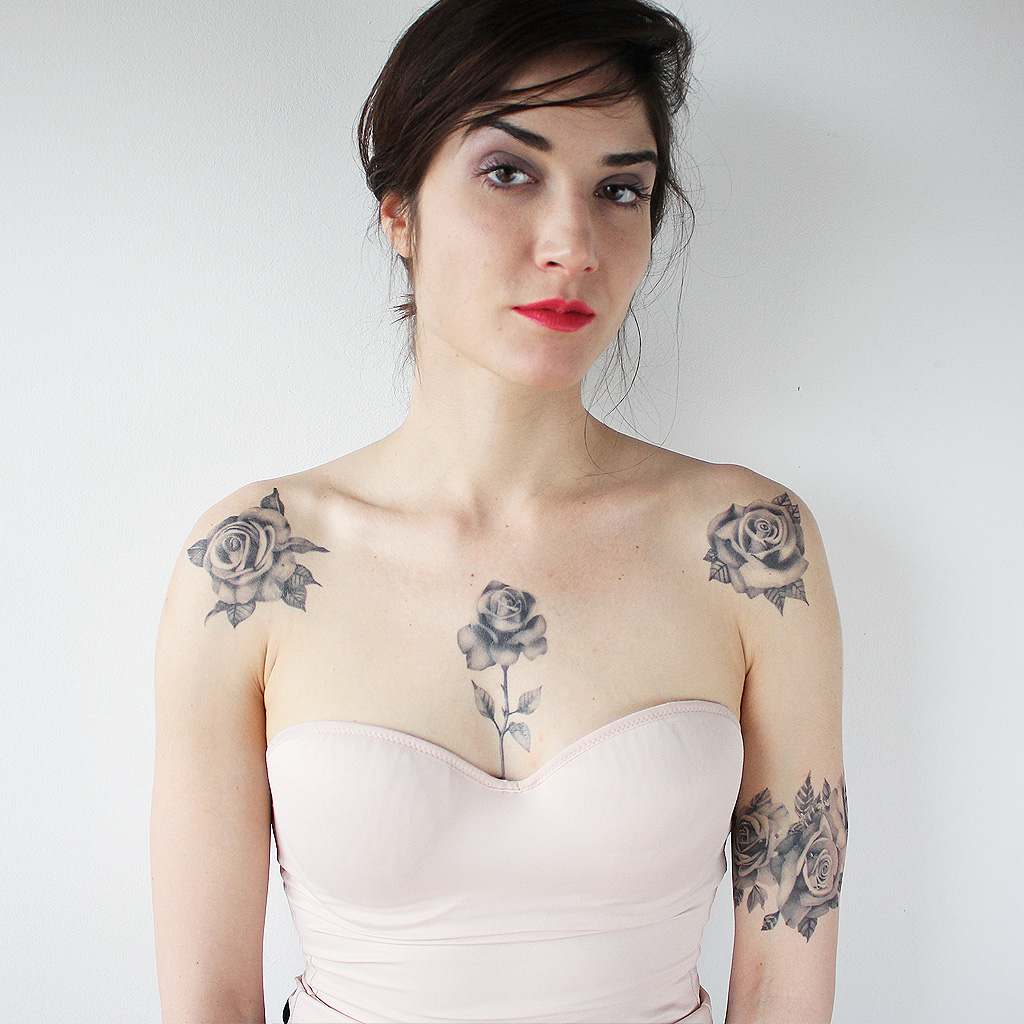 cute girl with rose tattoos