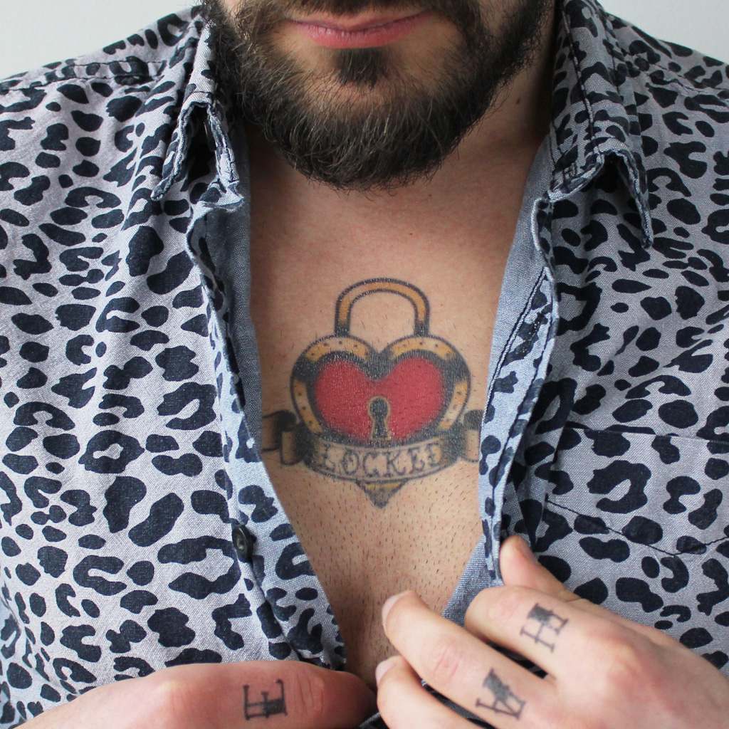 vintage locked heart tattoo