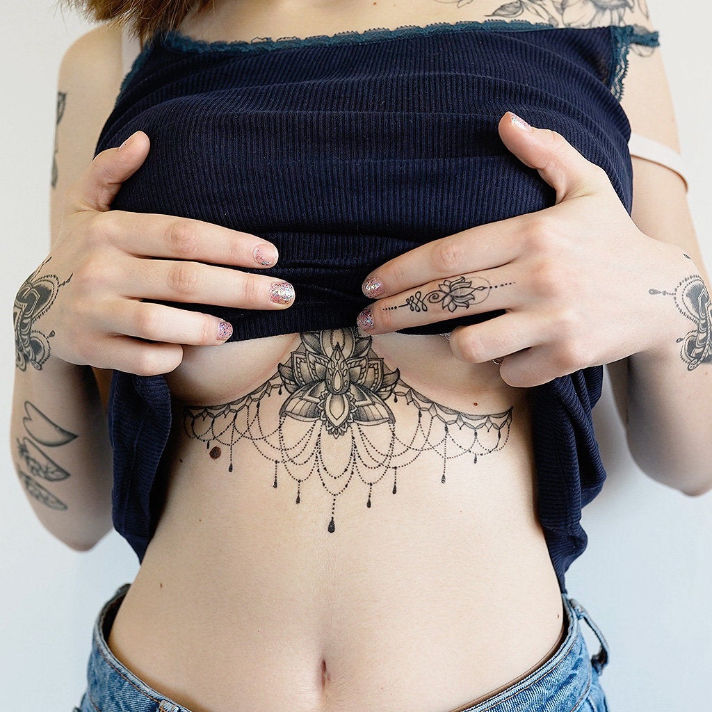 lotus flower underboob tattoo
