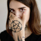 pentagram hand tattoo
