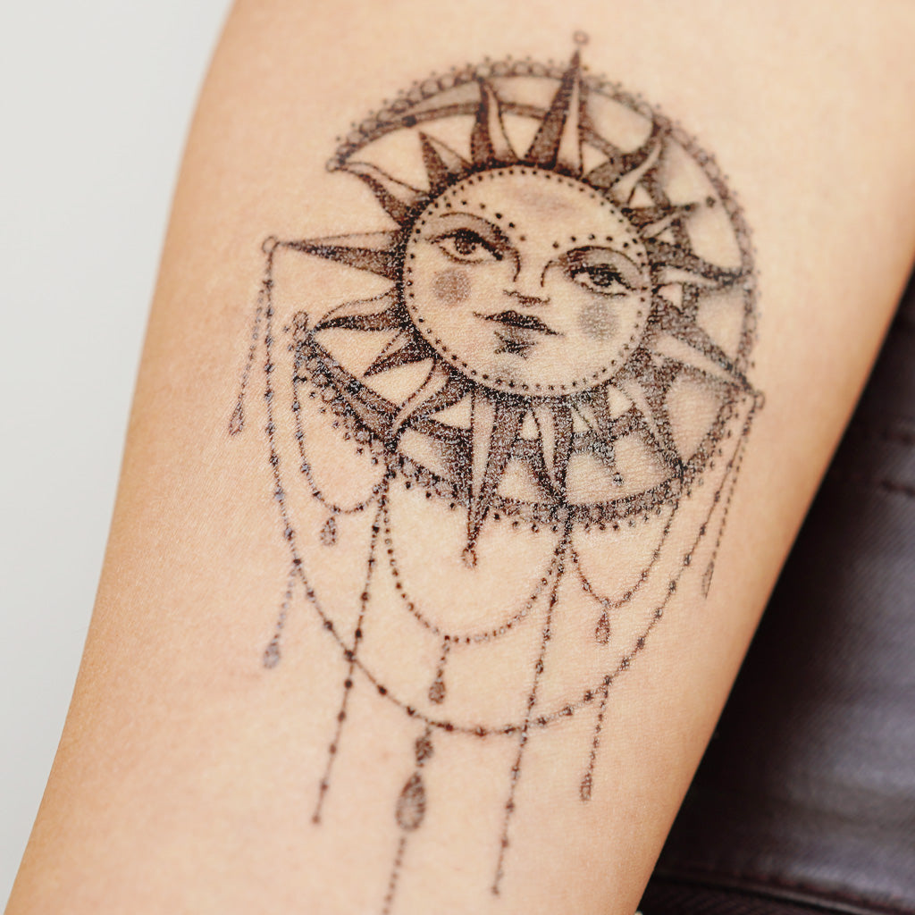 sun moon mandala tattoo