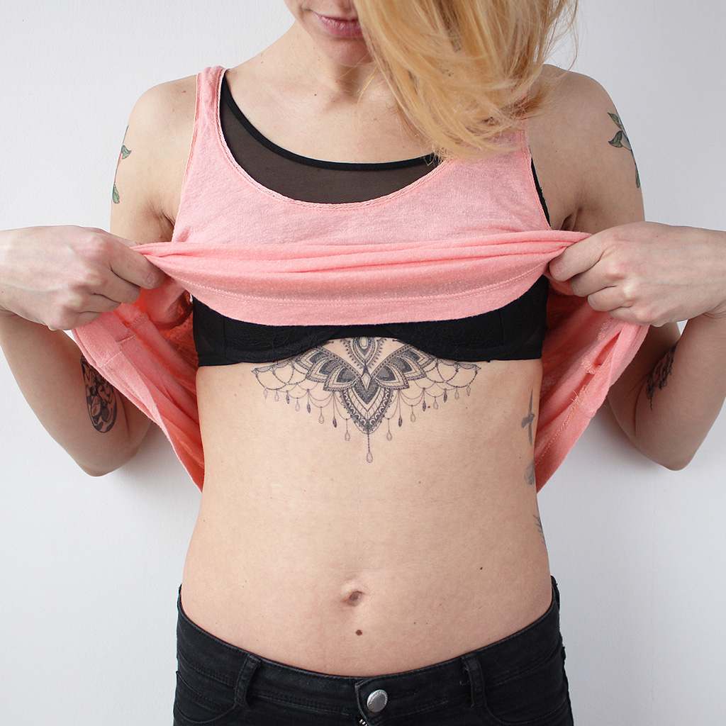 geometric underboob tattoo