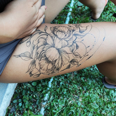 thigh floral tattoo
