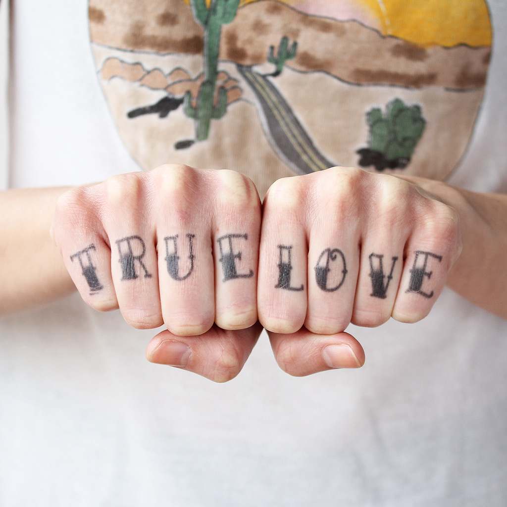 true love finger tattoo