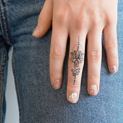 unalome lotus finger tattoo
