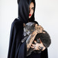 tattooed witch holding a cat
